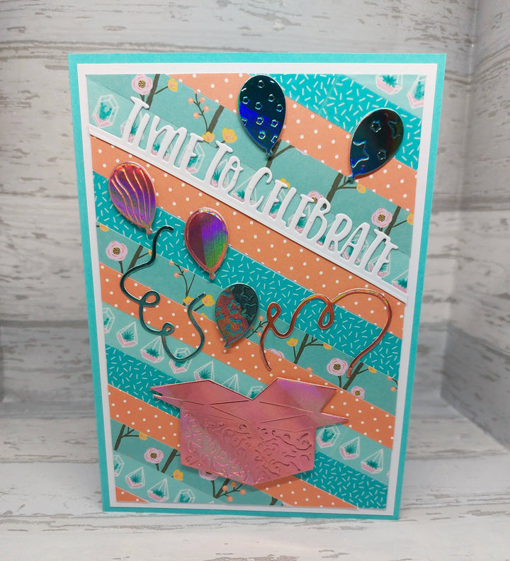 Kokorosa Metal Cutting Dies with Balloons Flying From Box