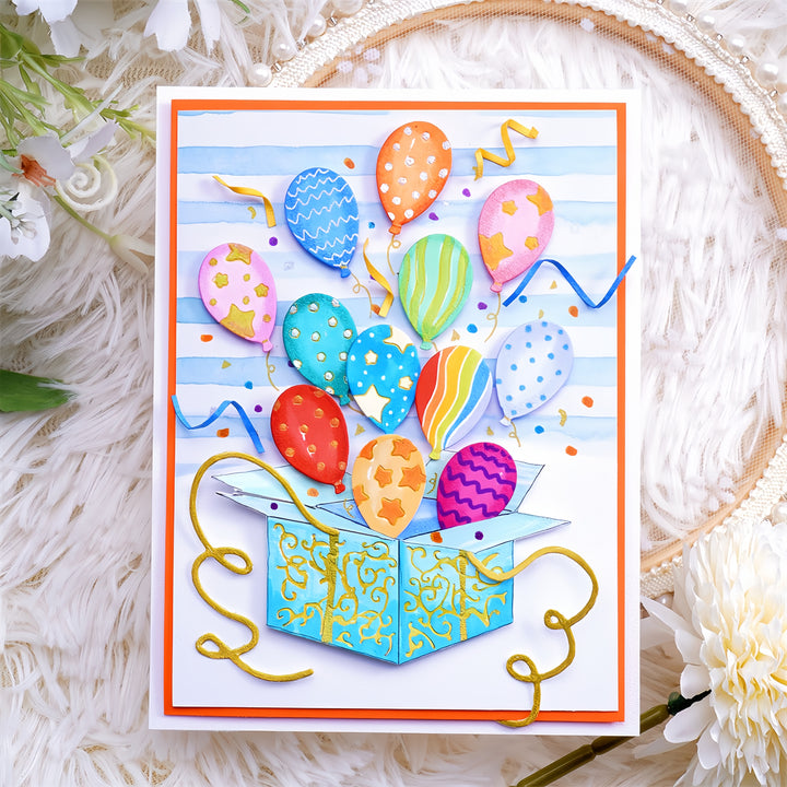 Kokorosa Metal Cutting Dies with Balloons Flying From Box