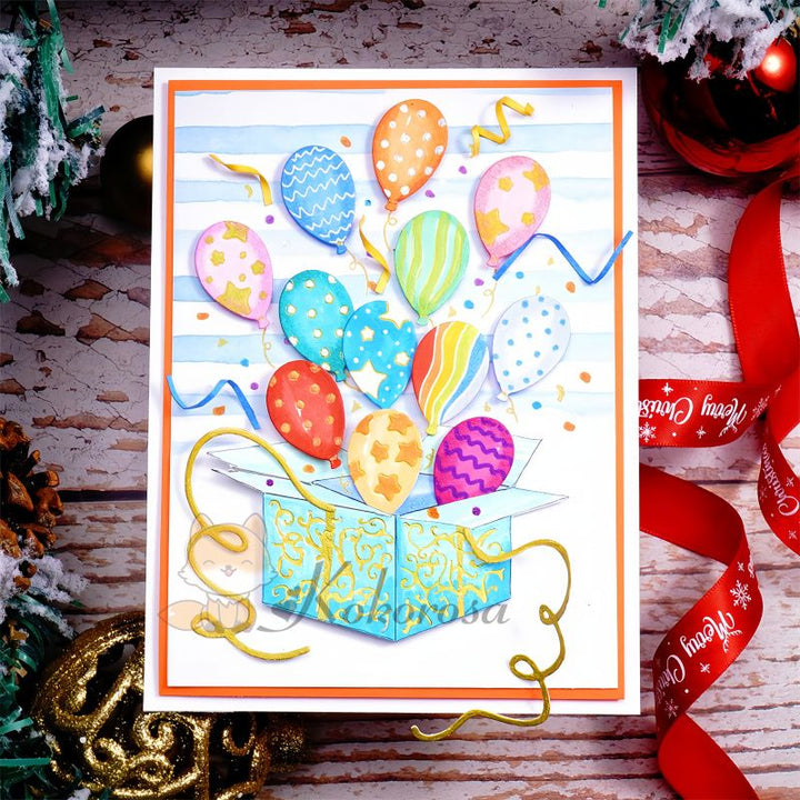 Kokorosa Metal Cutting Dies with Balloons Flying From Box