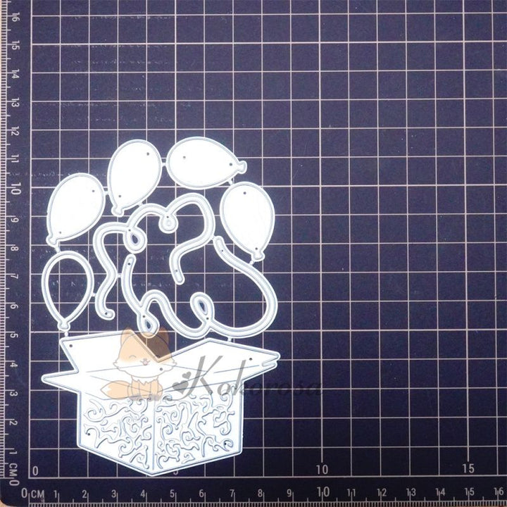 Kokorosa Metal Cutting Dies with Balloons Flying From Box