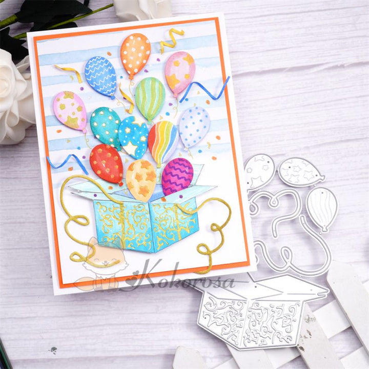 Kokorosa Metal Cutting Dies with Balloons Flying From Box