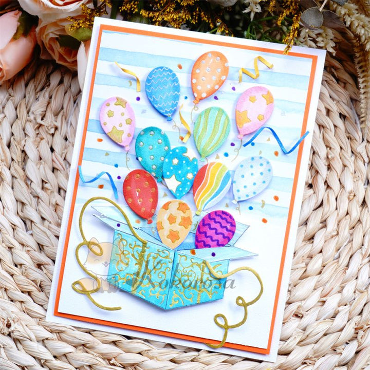 Kokorosa Metal Cutting Dies with Balloons Flying From Box