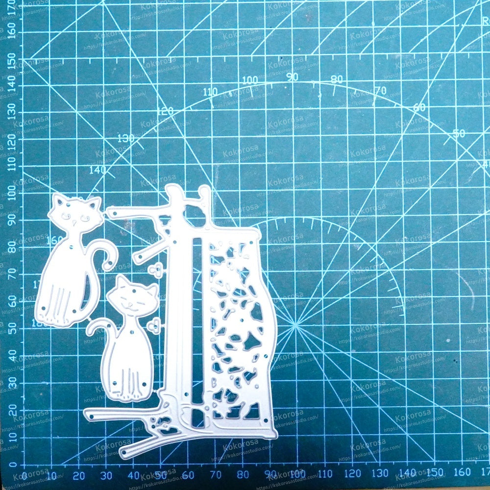 Kokorosa Metal Cutting Dies with Bench and Two Cats