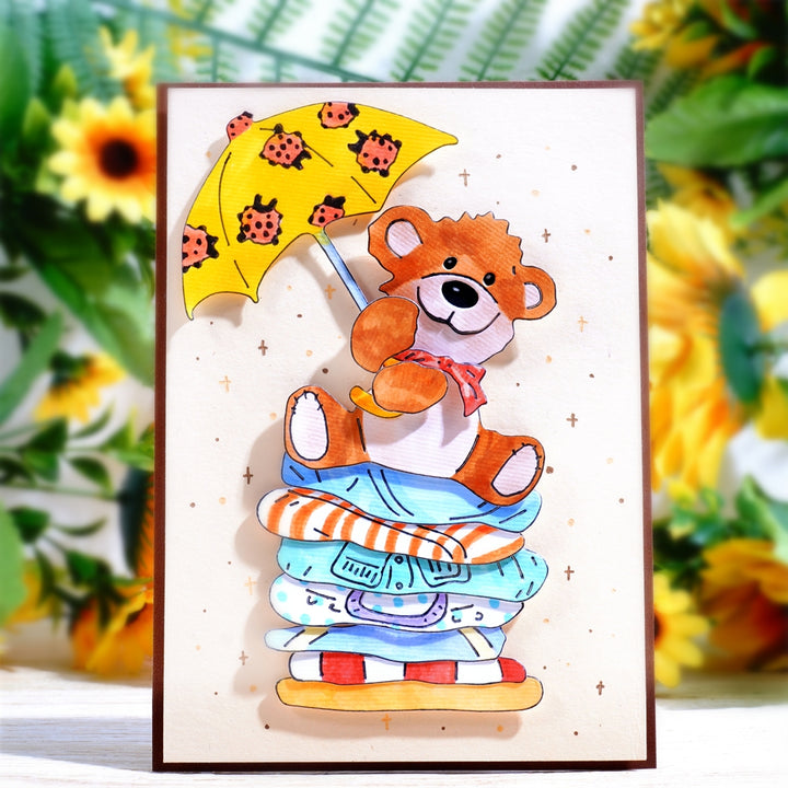 Kokorosa Metal Cutting Dies with Bear Holding an Umbrella Sitting on Sheets
