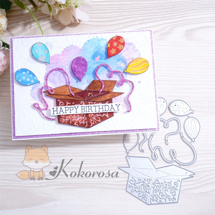 Kokorosa Metal Cutting Dies with Balloons Flying From Box